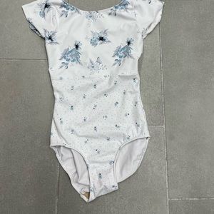 White with flowered cap sleeve Elevè leotard.